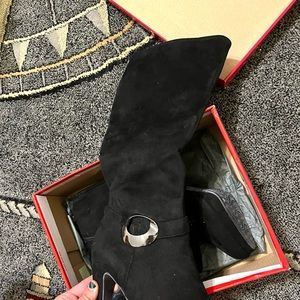 Size 8, Black high heeled boots. Brand new, never worn.